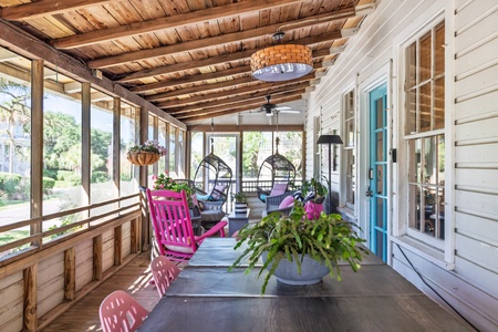 Settle into your sassy screened-in front porch
