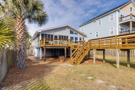 Take the steps down from the private deck to a grassy area