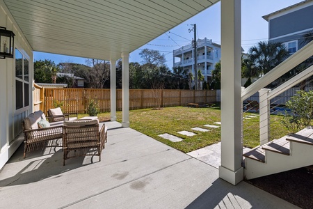 Sink into these comfortable wicker chairs on your private covered patio, where you can sip morning coffee while enjoying the peaceful garden view.