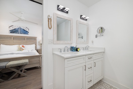 The primary en suite is equipped with a dual vanity and updated walk-in shower