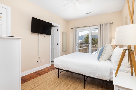The queen bedroom has private access to the main level deck