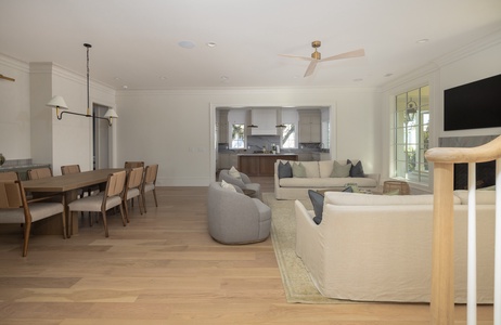 Your spacious open-concept haven blends elegant dining and cozy living spaces with modern kitchen views, perfect for memorable gatherings.