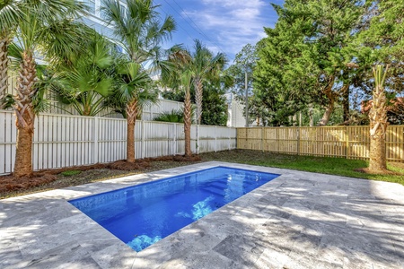 Dive into your private pool sanctuary, surrounded by tropical palms and complete privacy for the ultimate vacation escape.