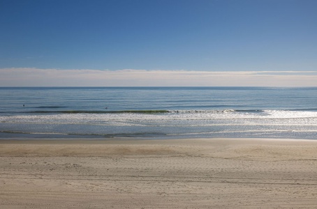Enjoy the expansive ocean views under clear blue skies.