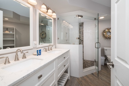 Your primary en suite bathroom has a large walk-in shower and dual vanity
