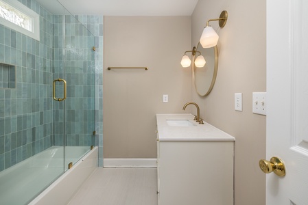 The king en suite bathroom has been recently renovated to include this beautiful tub-shower combo