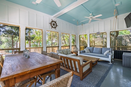 Your screened-in porch has tons of comfy seating and nautical touches