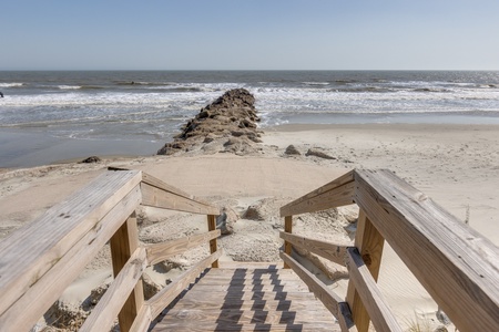 Wooden stairs take you down to the sand