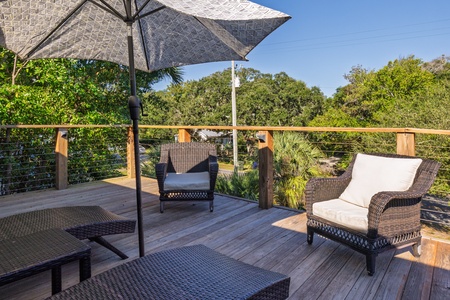 Relax under the umbrella on your private deck