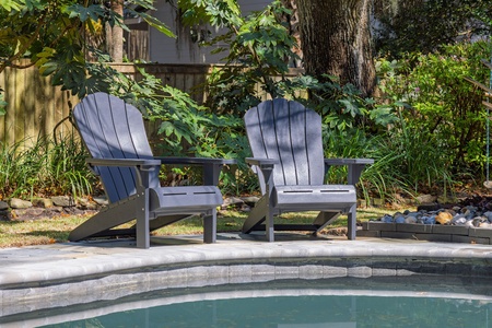 Slip into poolside bliss in your private Adirondack chairs, surrounded by lush gardens and mature trees for the perfect afternoon retreat.