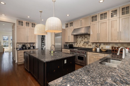 Your gourmet kitchen awaits with granite counters, stainless appliances, and a spacious island.