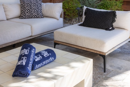 Sink into the plush outdoor seating of the shaded patio