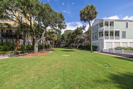 Enjoy a quiet moment on the lush green lawn, perfect for a picnic or a barefoot stroll at sunset.