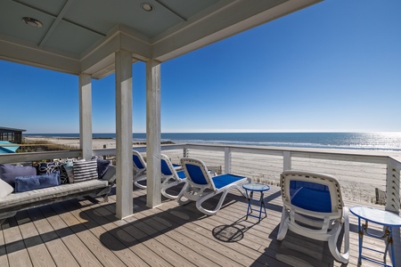 Relax on your private deck with stunning ocean views, comfortable seating, and direct beach access for the perfect coastal getaway.