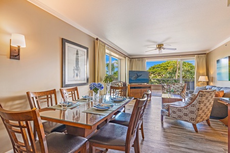 This bright, open-concept living and dining space features comfortable seating, smart TV, and plenty of room to gather.