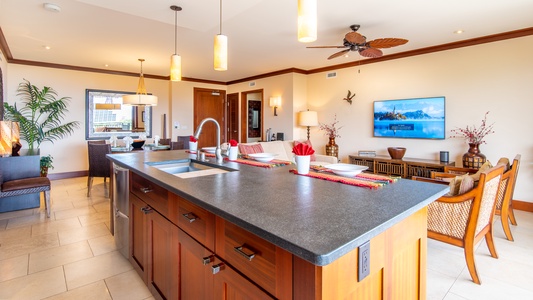 The kitchen island overlooks the living area and smart TV, making it the perfect gathering spot.