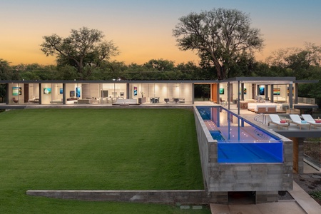 The perfect modern home with offers expansive lawn, and seamless indoor-outdoor flow.