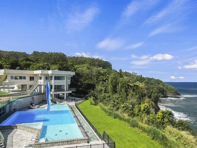 Make a splash down the thrilling waterslide into the infinity pool.