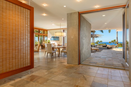 The airy foyer connects the home’s refined interiors with the natural beauty waiting just outside.