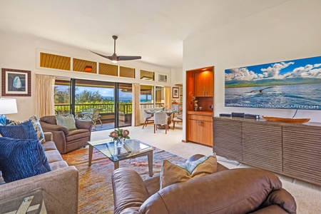 Unwind in the bright living room at Kapalua Ridge 2321, featuring cozy seating and serene outdoor vistas.