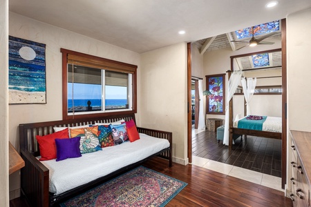 Daybed nook within the primary suite-featuring pocket doors to sperate the space