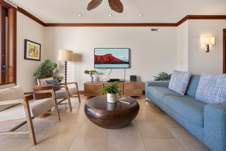 Sink into plush seating while tropical plants and warm wood tones create your perfect island retreat atmosphere.