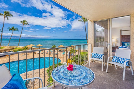Relax in the cozy living room at Royal Kahana 213 with direct lanai access and views of the ocean and grounds.