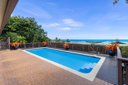 Dine alfresco by the pool with stunning ocean views.