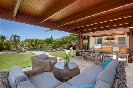 Gather in the outdoor lounge with comfortable seating and a shaded space to relax together.