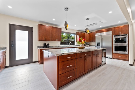 Gourmet kitchen with stainless steel appliances and a large island.