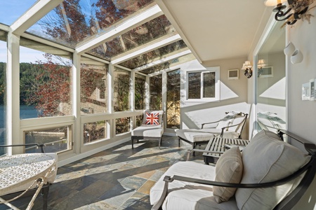 Vaulted ceilings and walls of windows draw your attention straight to the lake.