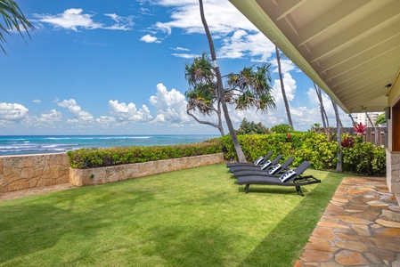 Soaring vaulted ceilings frame the oceanview living room, blending island elegance with open-air comfort.