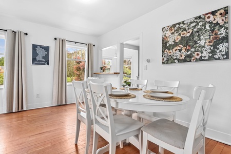 An inviting corner dining setup with modern farmhouse charm—great for intimate meals or remote work sessions.