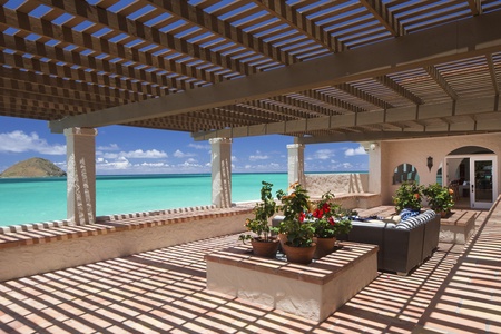 This stunning home opens directly onto soft sands and clear waters, inviting you to paradise.