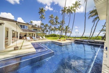 Luxurious pool area with views of the beach