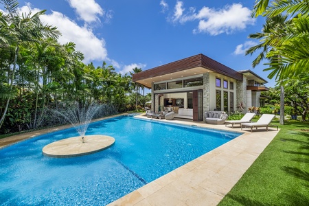 A large pool with a fountain and an ion-cleaning system, providing a chemical-free swim experience.