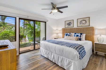 Peaceful lanai views at Wailea Ekolu 1605 with lush greenery and a peek of the ocean.