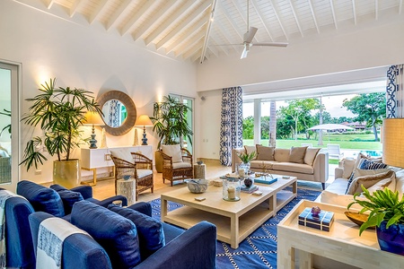 Elegant first living area with amazing pool and garden views.
