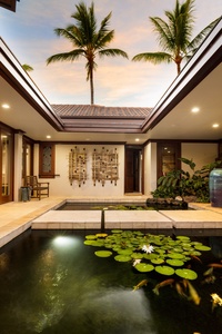 Tranquil courtyard with koi pond and island greenery welcomes you to your private oasis.