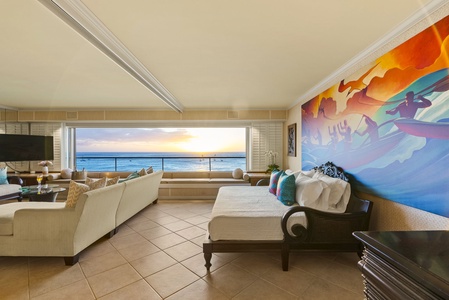 Seating area with vibrant artwork and golden hour views.