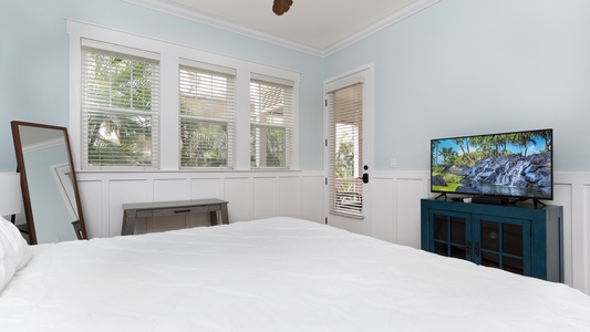 The primary guest bedroom with a television and scenic views.