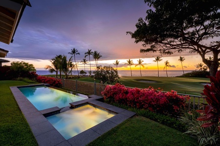Stunning sunset view over a luxurious pool.