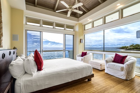 Primary bedroom fit for royalty—California king bed, ocean views, and luxurious natural light.