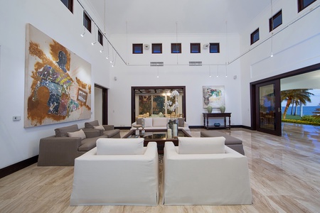 Elegant living spaces featuring modern art and custom lighting.