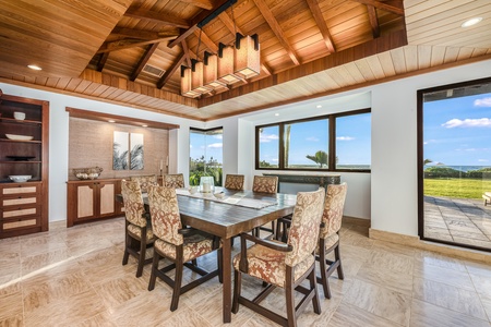 Dine and lounge indoors or out—the living space flows effortlessly to extensive lanais.