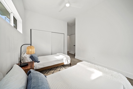 Minimalist-style guest suite with cozy bedding for a peaceful retreat.