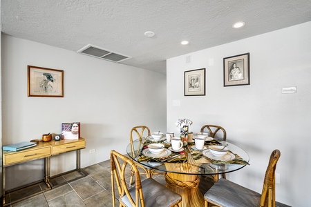 Whether you're enjoying breakfast before an adventure or playing cards after sunset, the dining table comfortably seats four guests.