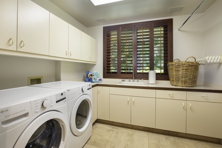 Your dedicated laundry room features modern appliances and ample counter space for convenient sorting and folding.