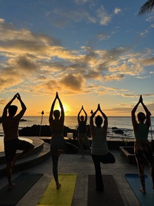 Experience tranquility with a sunset yoga session overlooking the ocean.