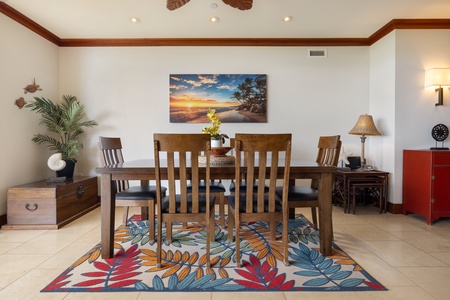 Gather around your elegant dining table with sunset views to inspire memorable meals together in this tastefully decorated space.